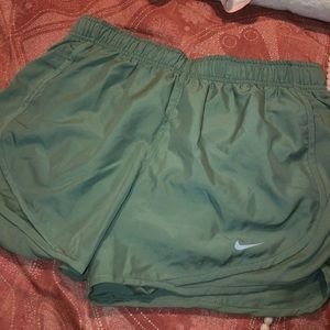Army green Nike running shorts